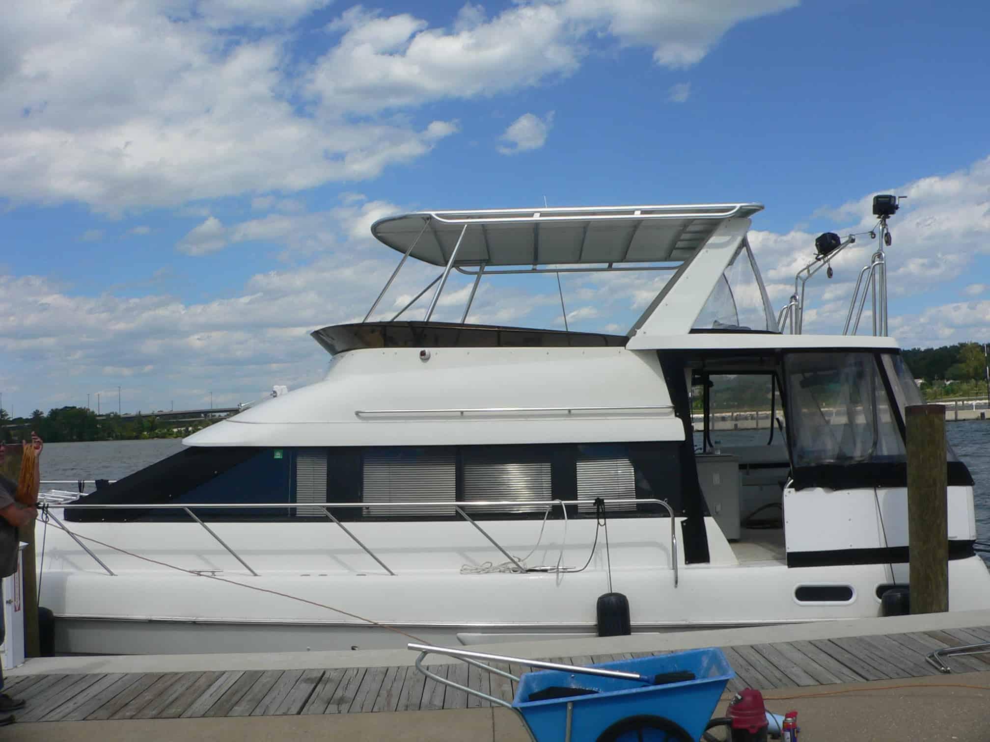 Atlantic Towers Top installed on a Silverton 46 motor yacht, shown in a side view on calm water during daytime.