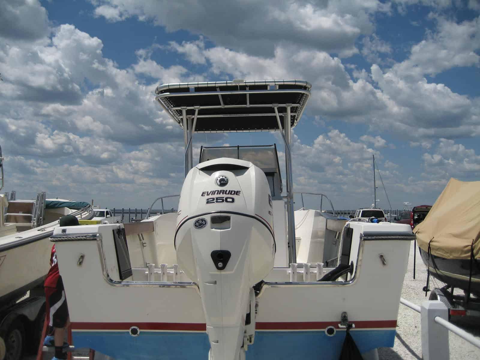 Atlantic Towers T-Top installed on a Pursuit 24 center console boat shown from the side on water