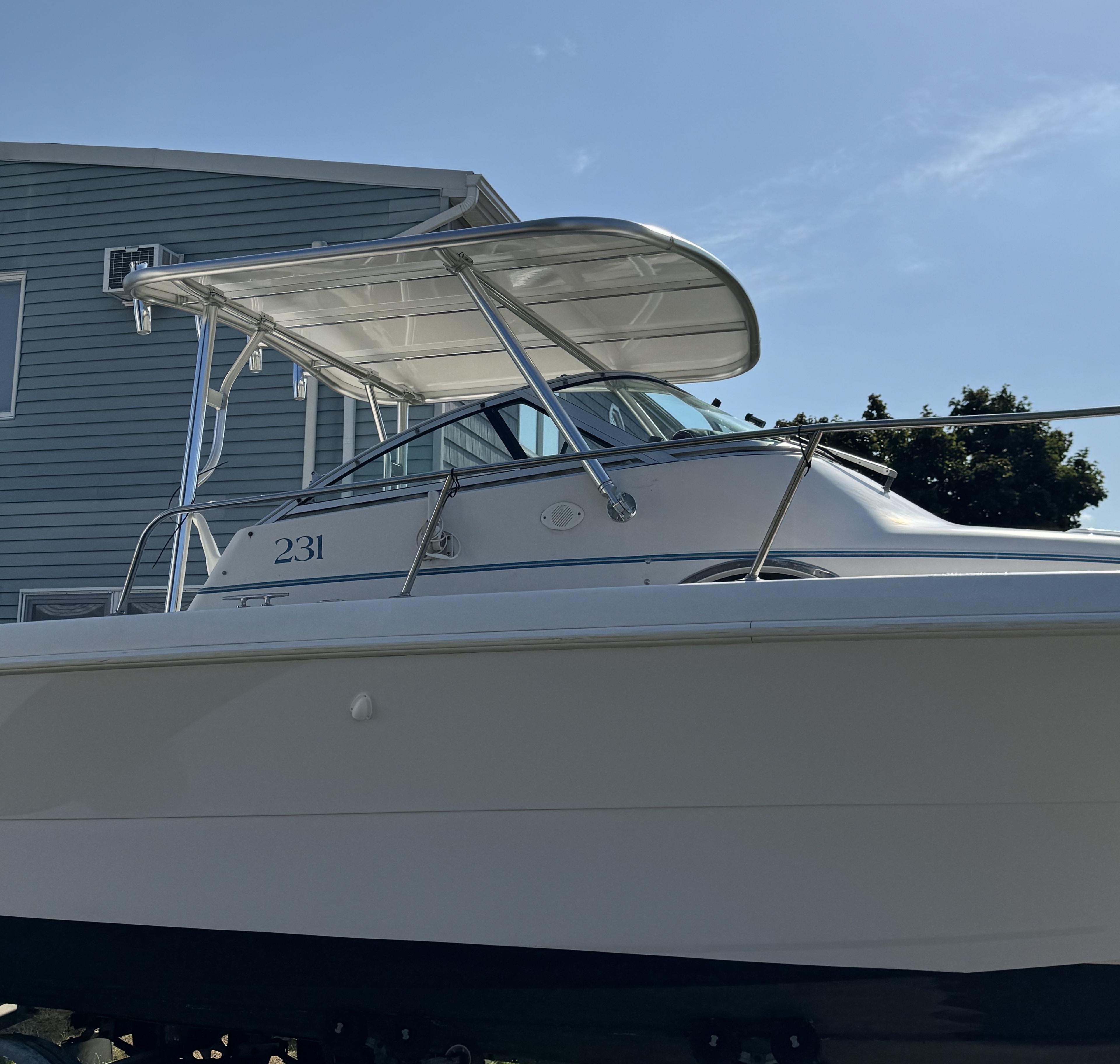 Atlantic Towers Top installed on a Pro Line boat, showcasing the sleek design and protective overhead structure.