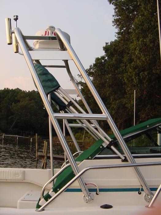 Atlantic Towers Arch installed on a Sea Pro 210 W/A boat, featuring a sturdy aluminum frame and green upholstery.