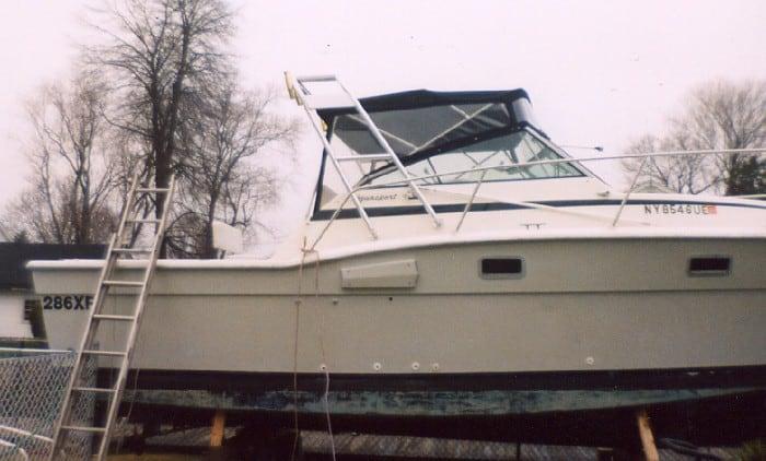 Atlantic Towers Arch installed on an Aquasport 286XF boat, showcased on a support structure in a yard.