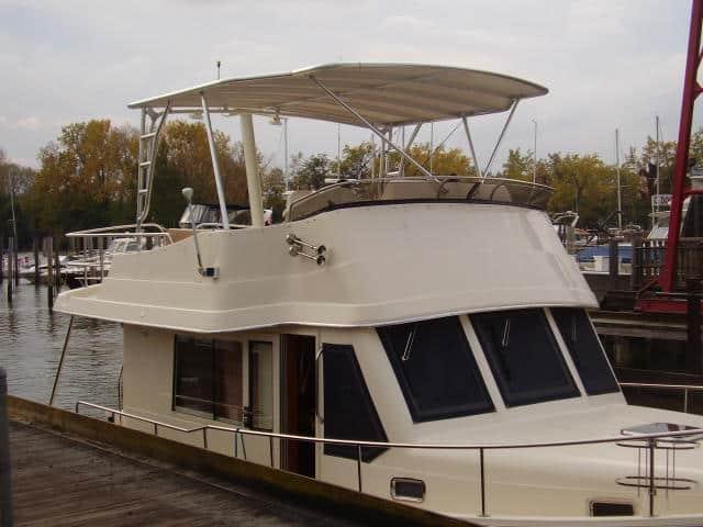Atlantic Towers Top installed on a Mainship 34 Trawler boat, showcasing its design at a marina.