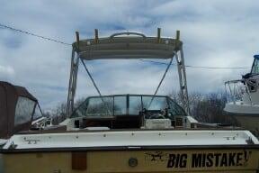 Atlantic Towers Top installed on a Slickcraft 240SF boat with "BIG MISTAKE!" decal on the stern at dock.