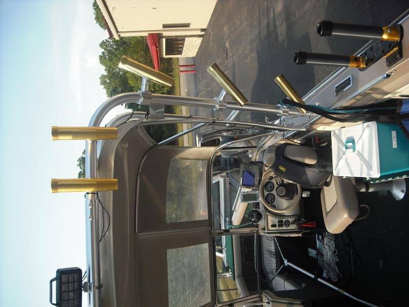 Atlantic Towers Arch installed on a Lund 2150 Baron Magnum boat, showcasing the interior control area and accessories.