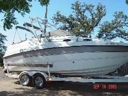 Atlantic Towers Arch installed on a Chaparral 240 Signature boat, positioned on a trailer in an outdoor setting.