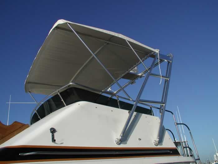 Atlantic Towers arch on a Trojan F32 sedan boat, showcasing a sleek design perfect for enhancing outdoor experiences.