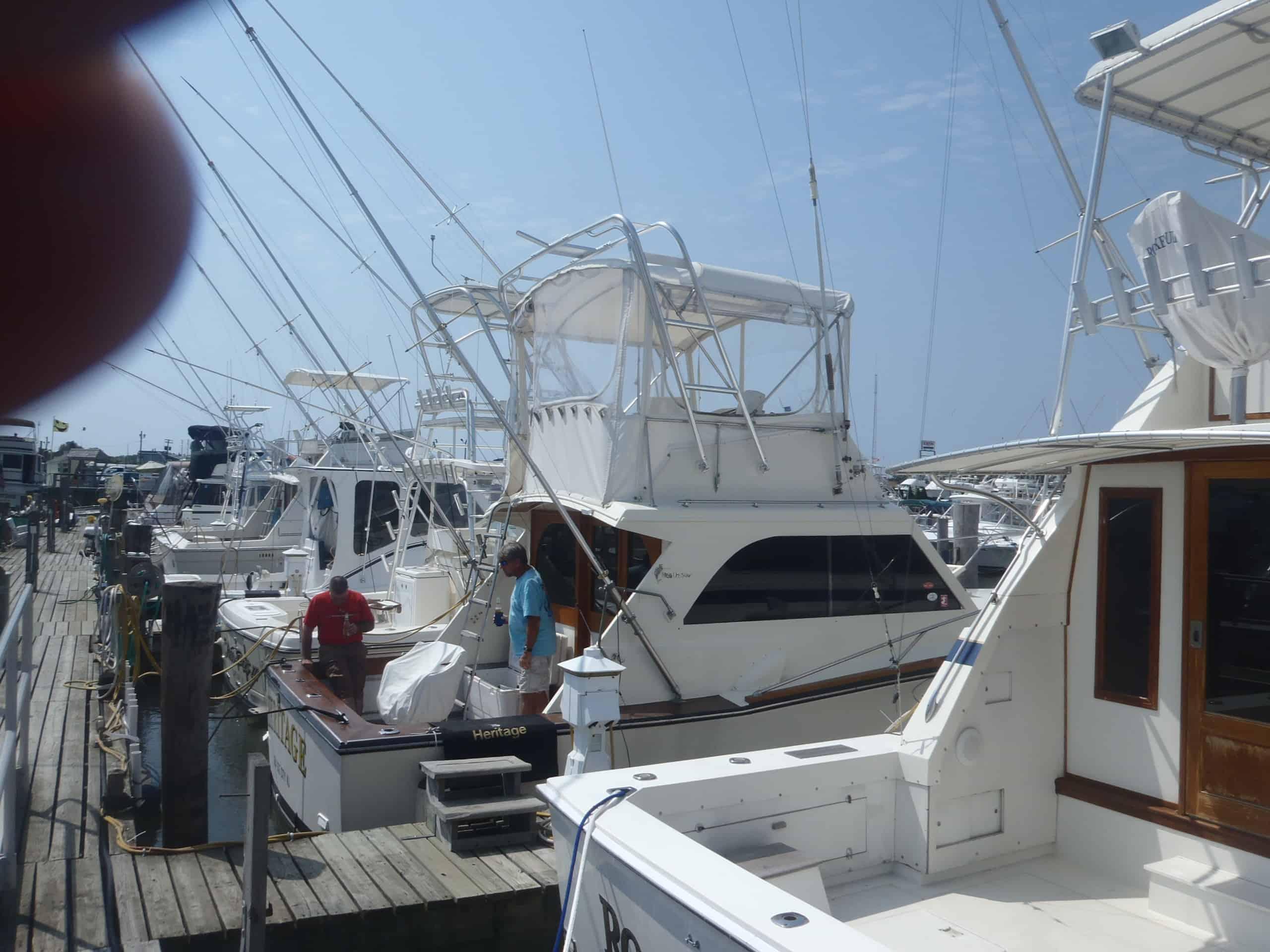Atlantic Towers Arch installed on Egg Harbor 33 flybridge boat, showcasing a polished metal frame above the cabin.
