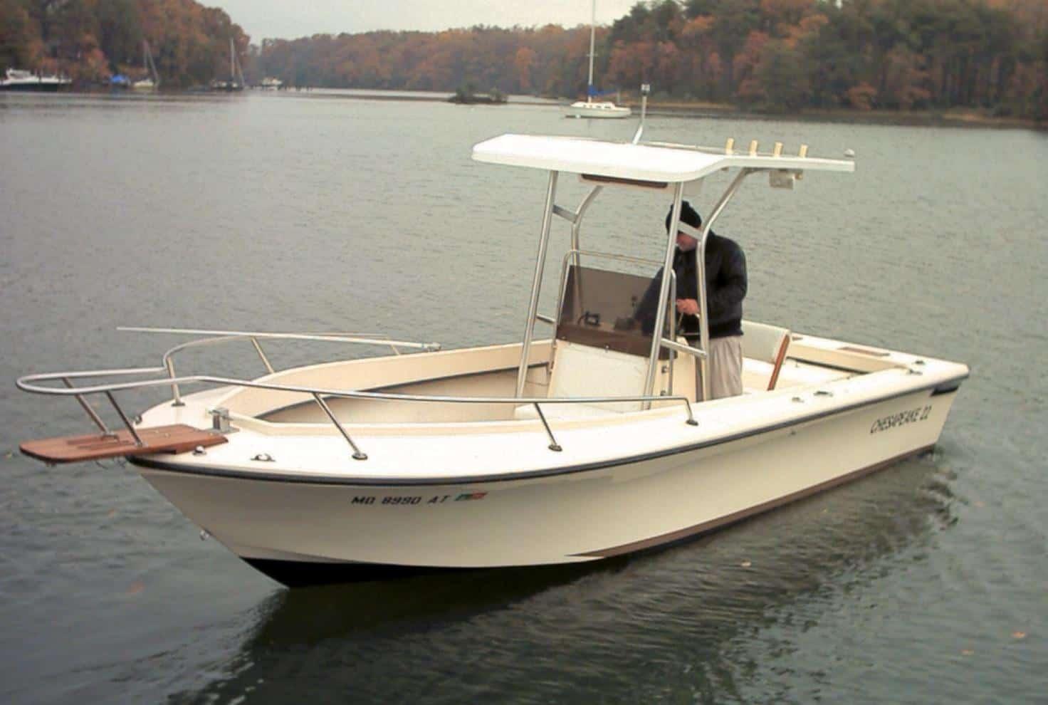 Atlantic Towers T-Top installed on a Chesapeake Boats Center Console, moored in calm waters with fall foliage in background.