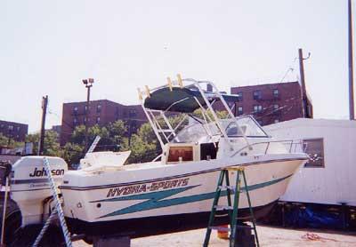 Atlantic Towers Arch installed on a Hydra Sports 2150 WA boat, displayed in a marina setting.
