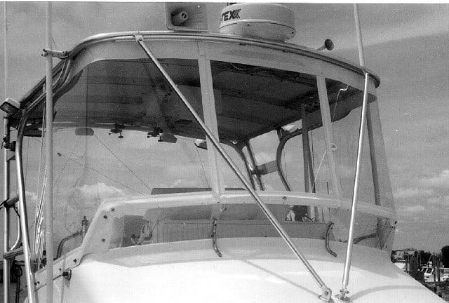 Close-up view of the helm area on an Ocean 29 Super Sport boat with an installed Atlantic Towers Top canopy.