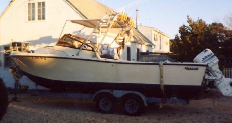 Atlantic Towers Top installed on a Mako 258 boat, parked on a trailer in front of a house.