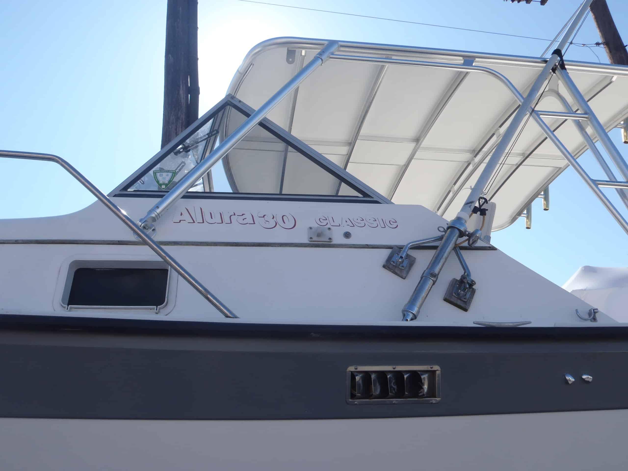 Atlantic Towers Top installed on an Alura 30 boat, showcasing the boat's design and features.