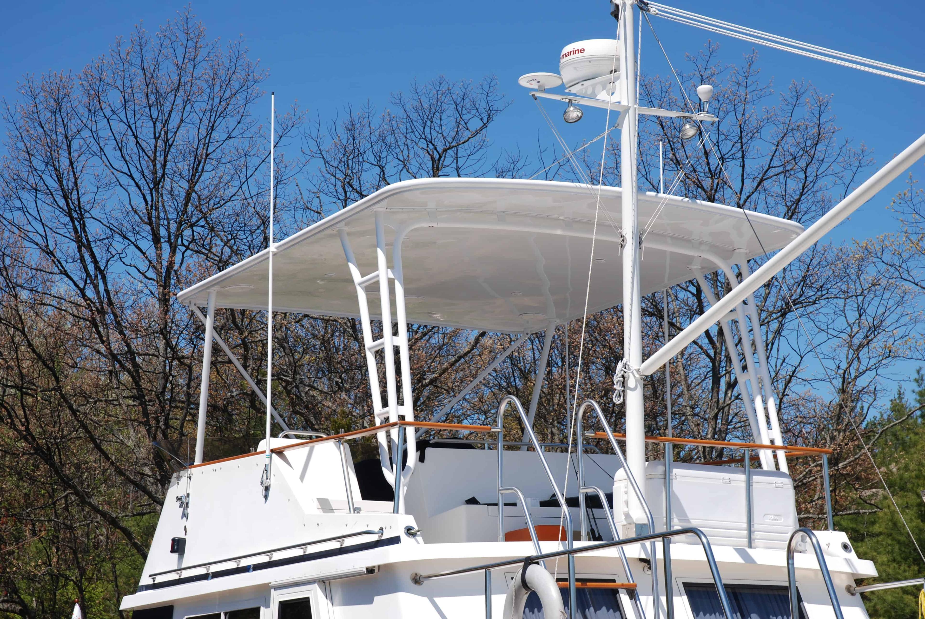 Atlantic Towers Top installed on a Monk 42 Trawler, featuring a spacious upper deck with white canopy and railings.