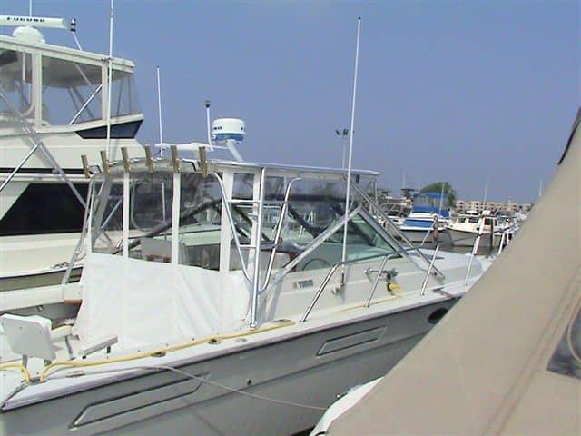Atlantic Towers Top installed on a Tiara 3100 Open cruiser boat shown docked by a marina.