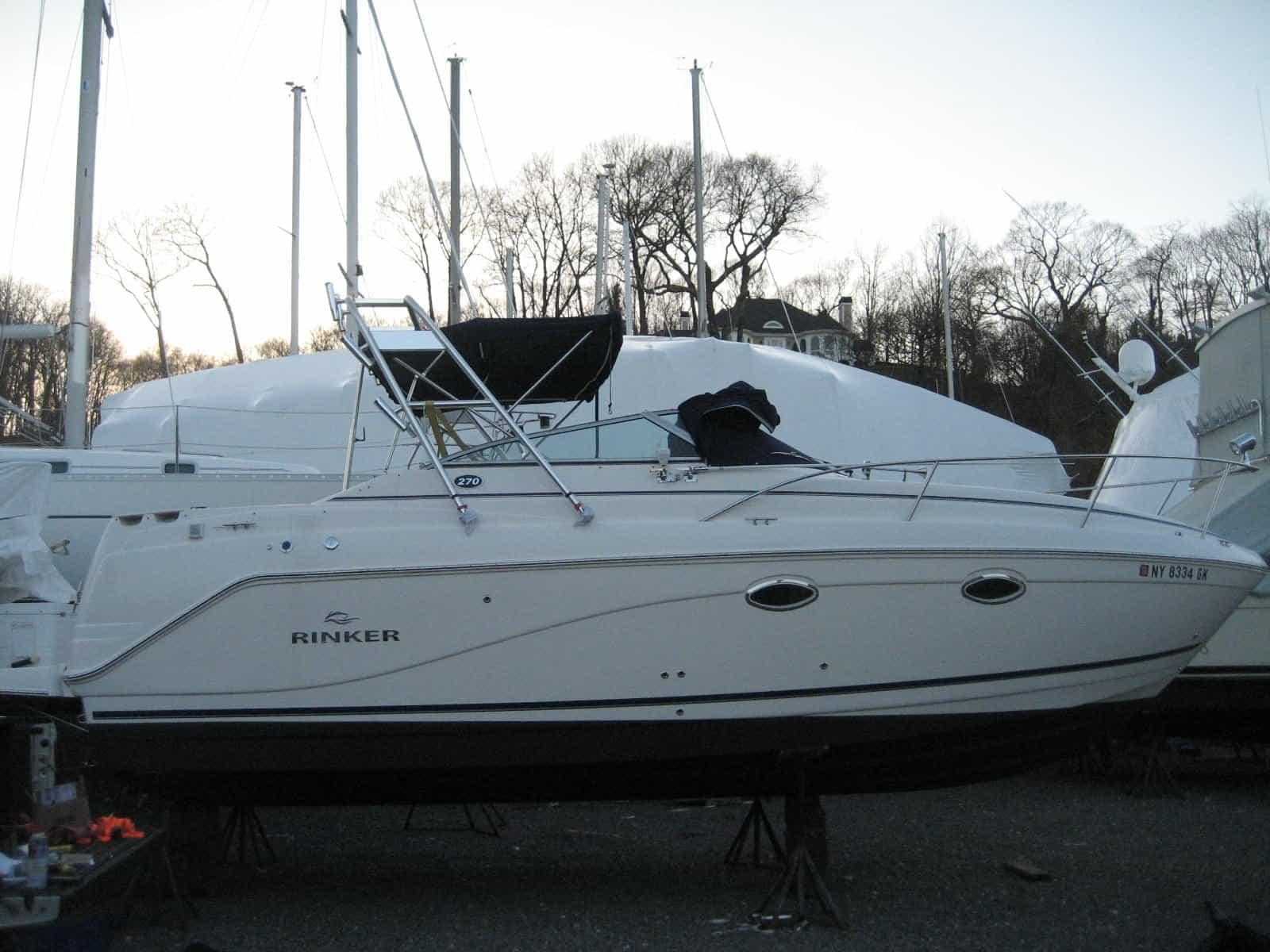 Atlantic Towers Arch installed on a Rinker 270 Fiesta Vee express cruiser with white hull and cabin windows