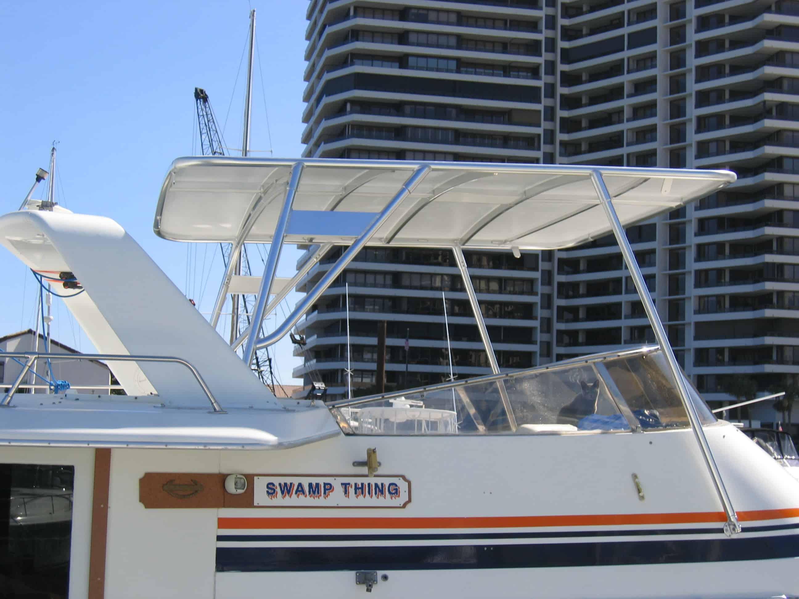 Atlantic Towers Top installed on a Gulfstar 44 Motor Yacht, featuring an open design in a marina setting.