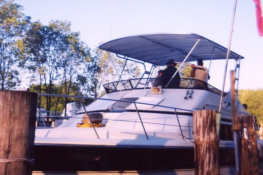 Atlantic Towers Top installed on a Carver 38 Santego boat, docked with people enjoying the view.