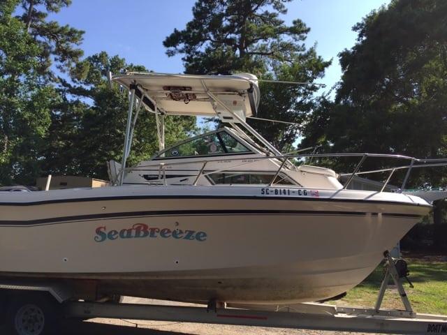 Atlantic Towers Top installed on a Grady White boat named SeaBreeze, parked on a trailer under a tree.
