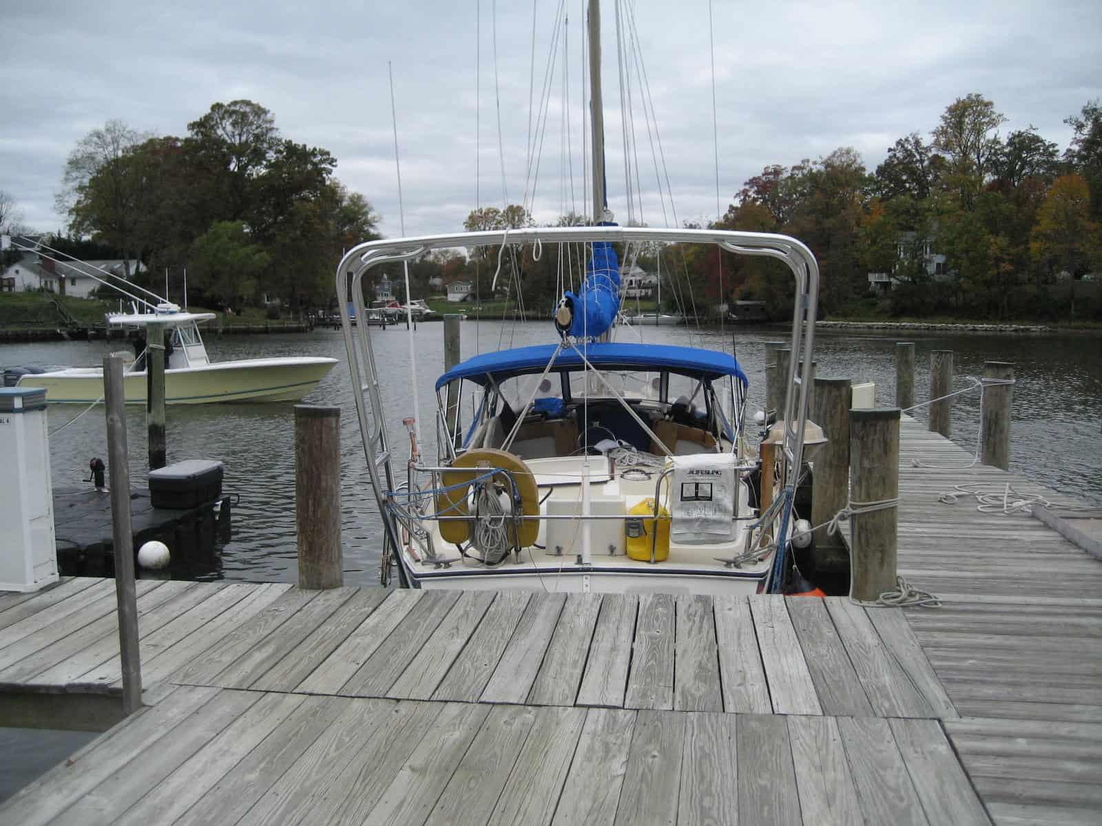 Atlantic Towers Arch installed on an O'Day 37 Center Cockpit sailboat against a cloudy sky background.