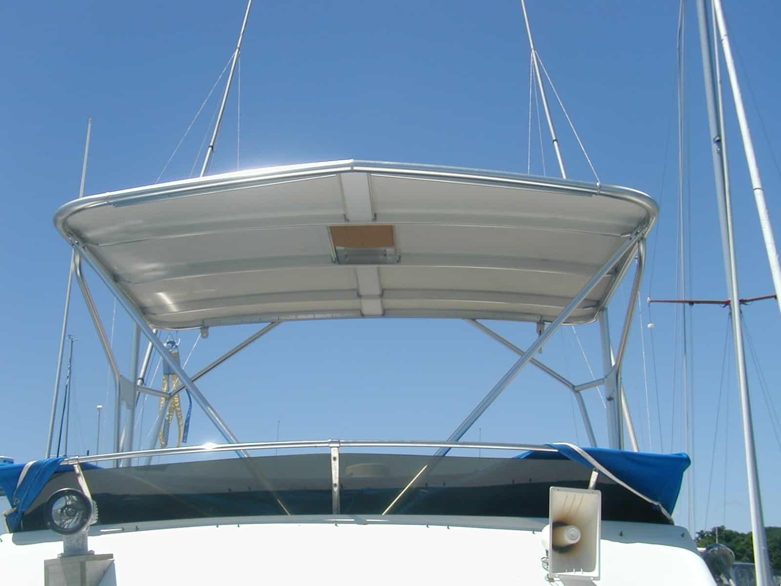 Atlantic Towers Top installed on a Trojan F32 sedan boat, showcasing its sleek design and functionality.