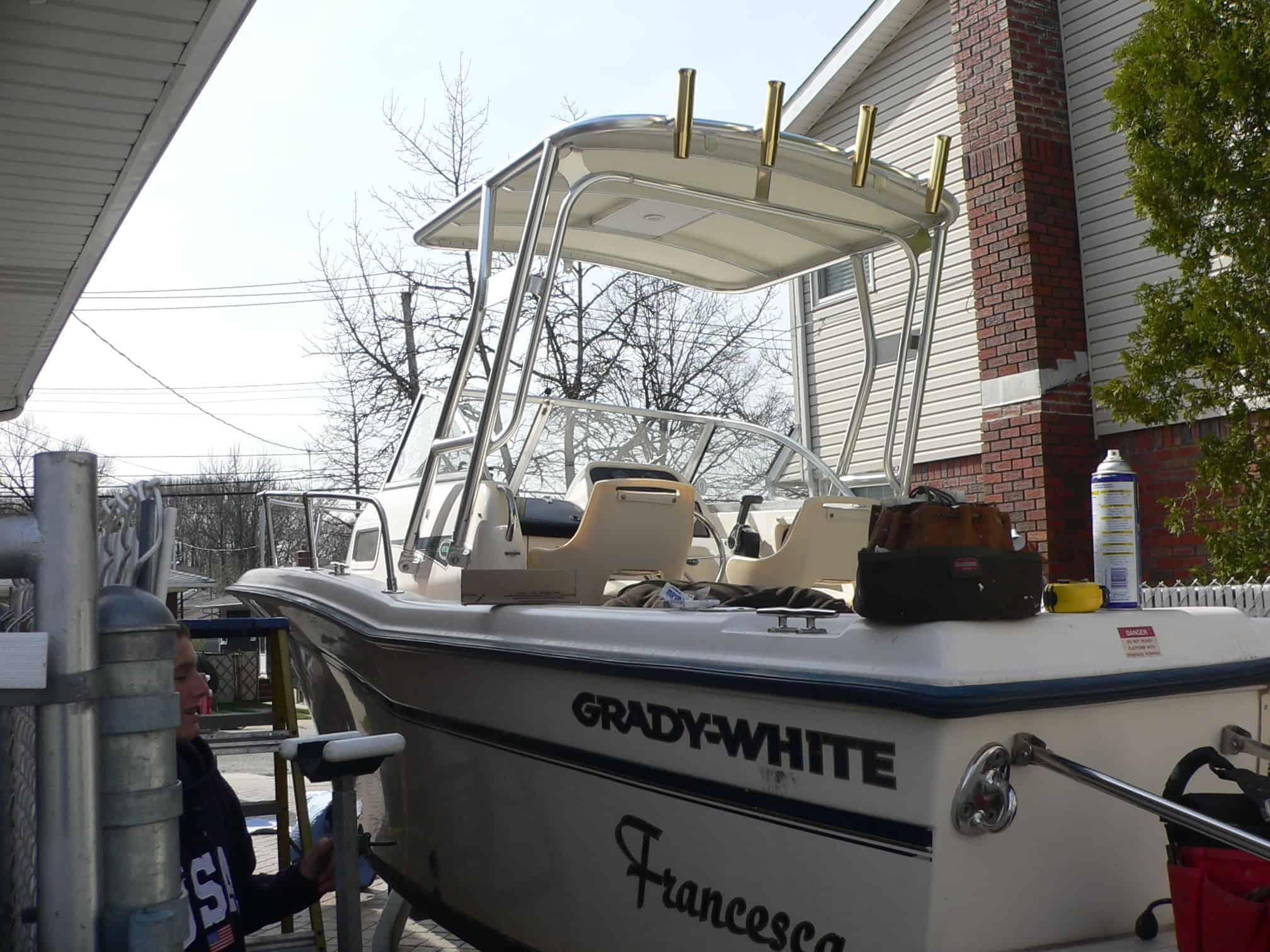 Atlantic Towers Top installed on a Grady White 208 Adventure walkaround boat shown on water with blue sky background