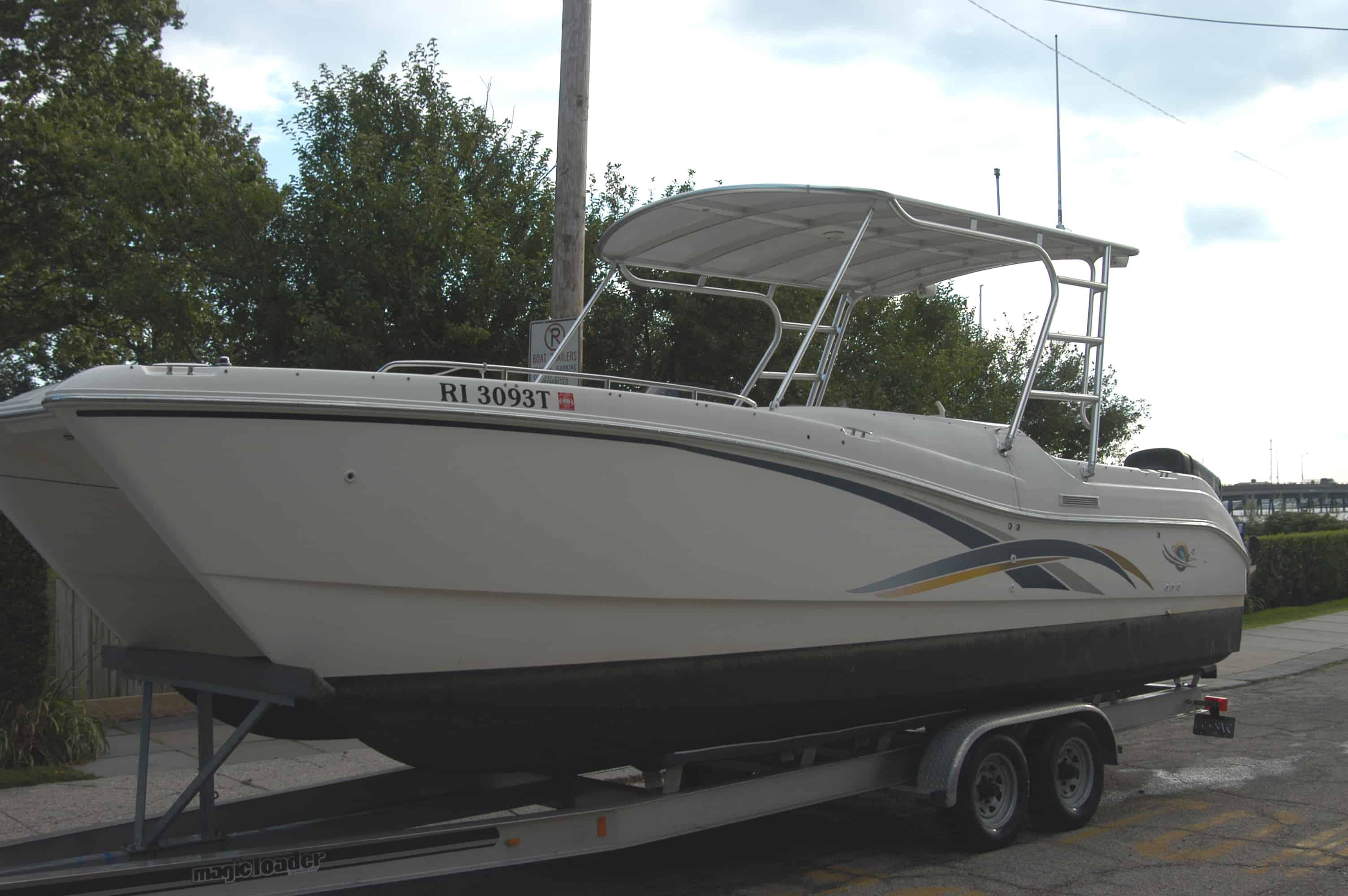 Atlantic Towers Top installed on a World Cat 266 LC Offshore boat on a trailer, surrounded by greenery.