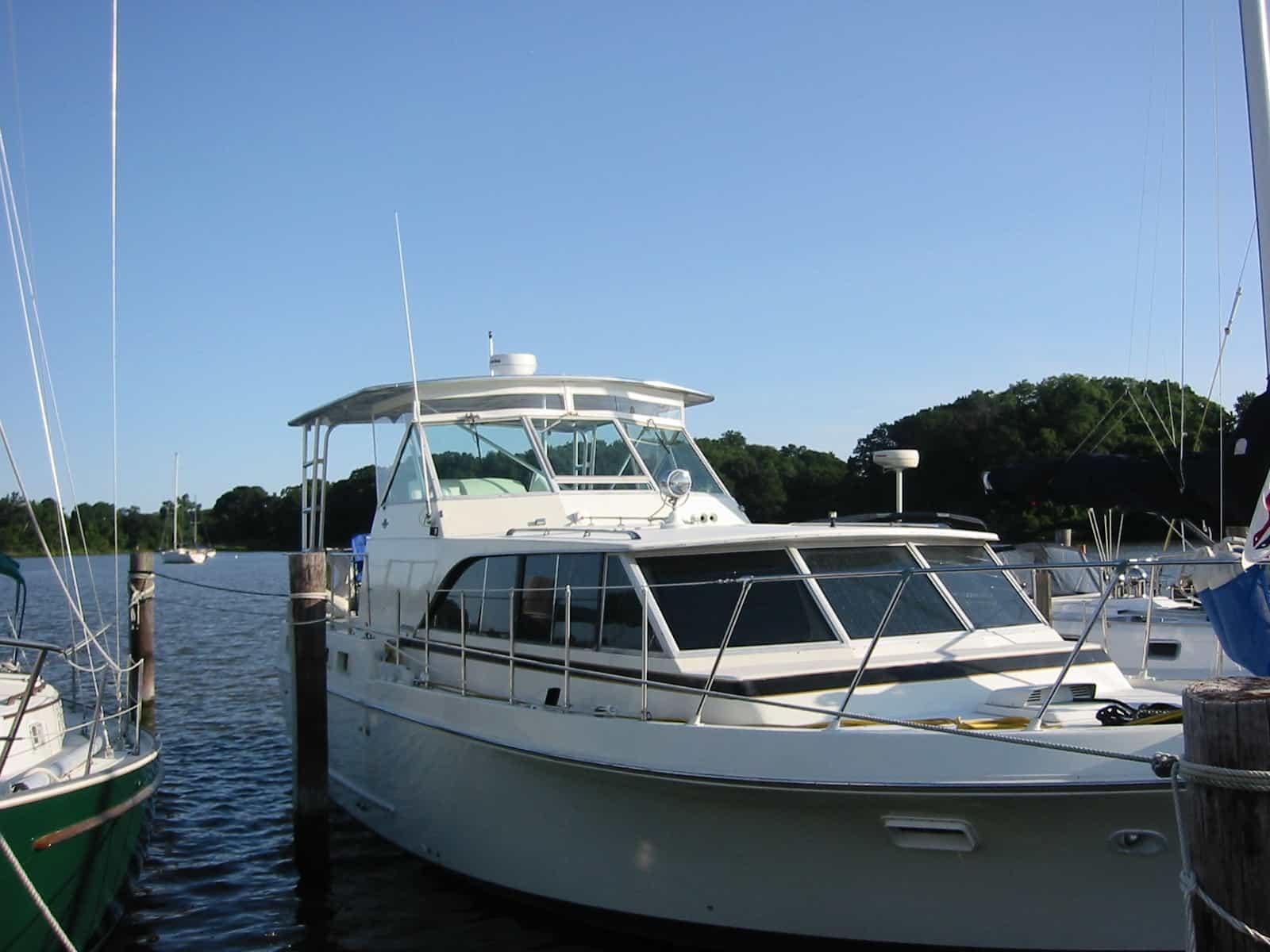 Atlantic Towers Top installed on a Bertram 38 Motor Yacht docked at a marina on a clear day.