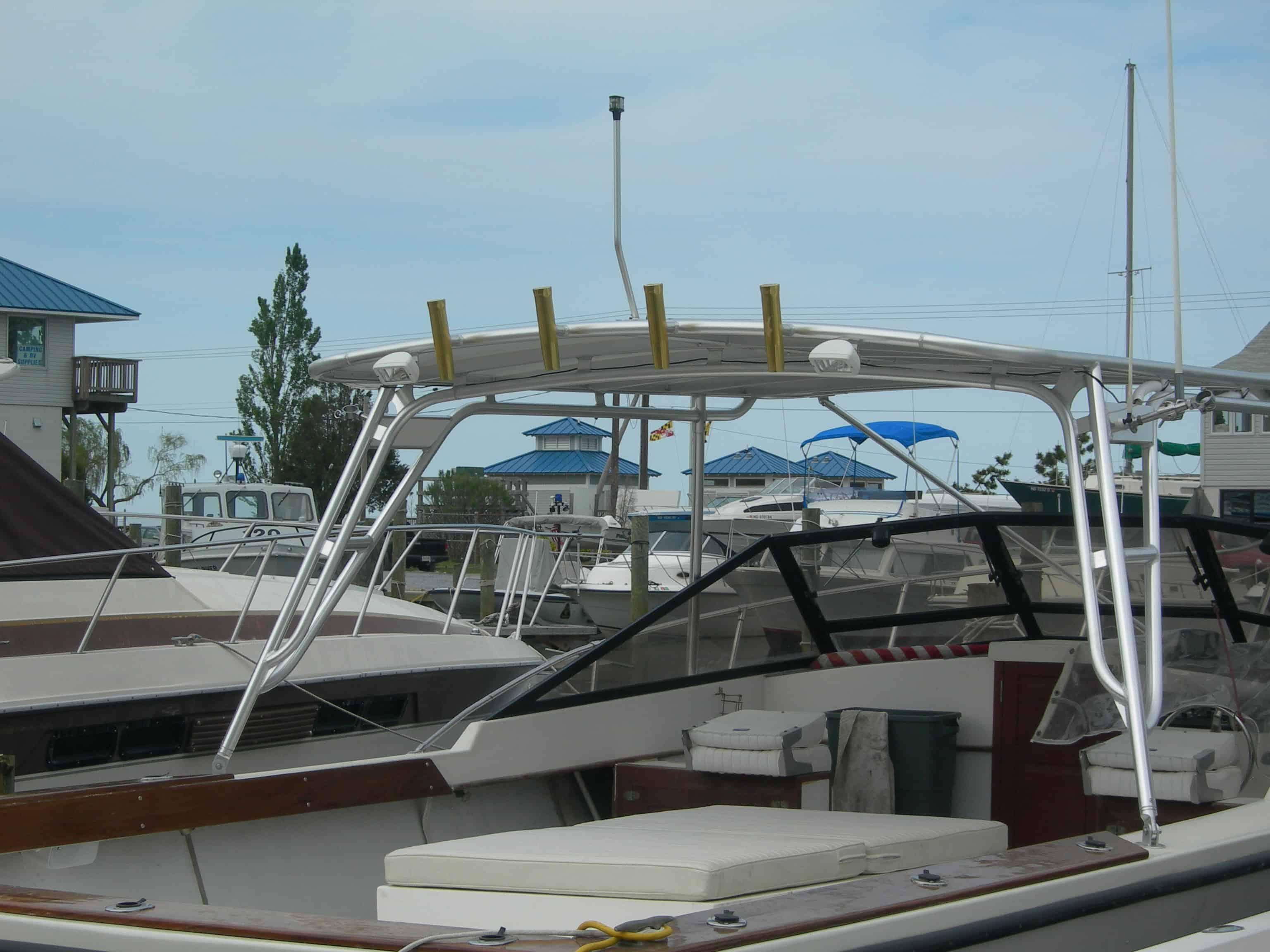 Atlantic Towers Top installed on Island Hopper 30 Skiff boat, showing aluminum frame and rod holders over the deck.