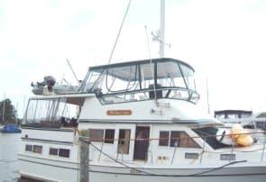 Atlantic Towers Top installed on a Labelle 40 Motor Yacht docked at a marina with a covered upper deck.