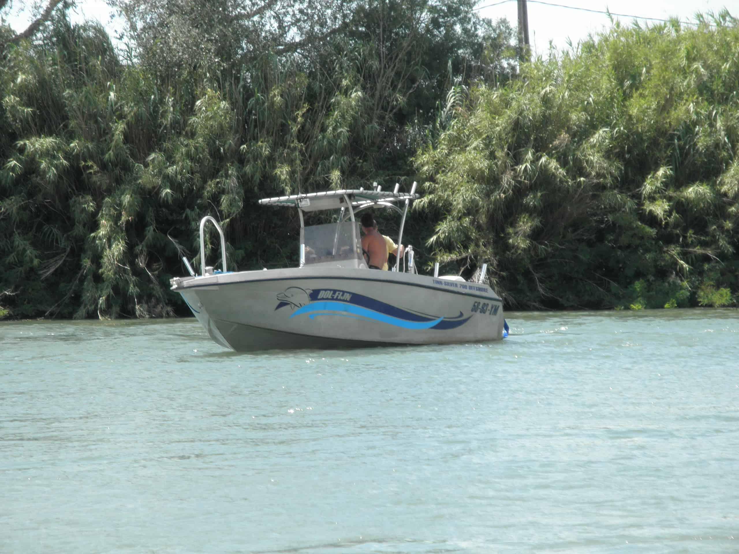 Atlantic Towers T-Top installed on a Tinn Silver 8 Meter center console boat shown on calm water.