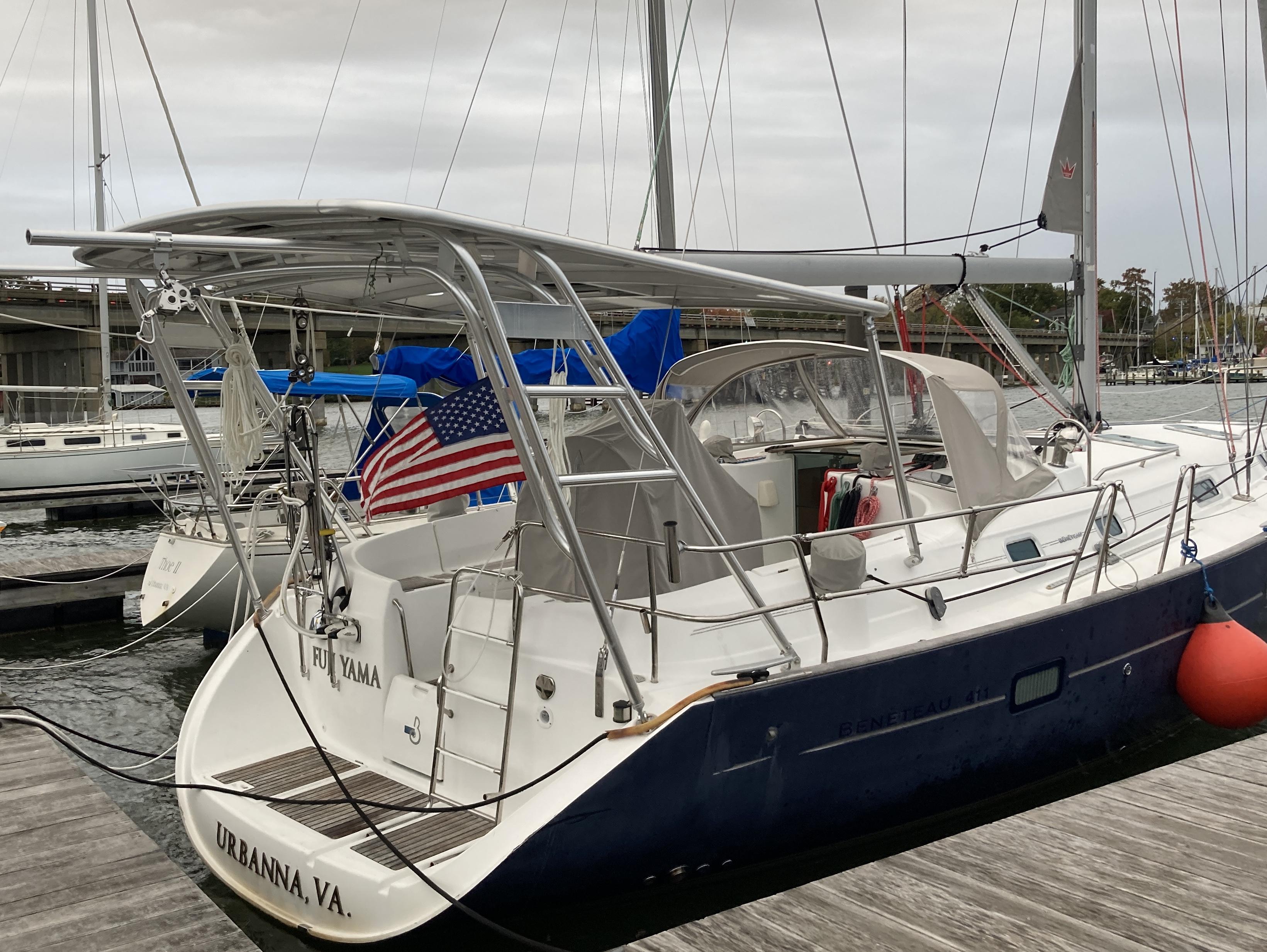 Atlantic Towers Top installed on a Beneteau boat, docked with an American flag and various marine equipment visible.