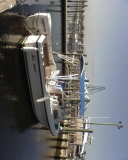 Atlantic Towers Top installed on Sea Ox 20C walkaround boat with black metal frame and canvas canopy