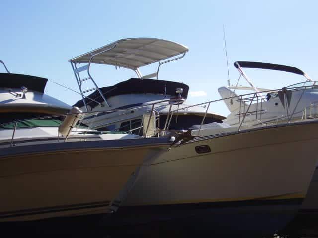 Atlantic Towers Top installed on Tollycraft 34 Sedan boats docked side by side with blue sky background.