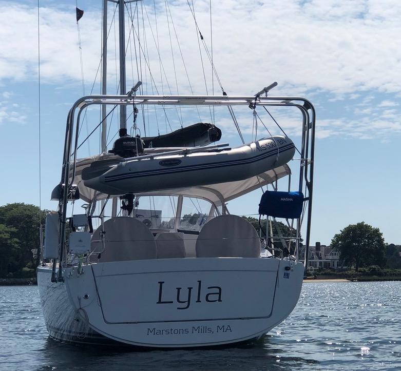 Atlantic Towers Arch installed on a Hanse boat named Lyla, docked with a dinghy overhead and clear skies.