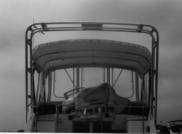 Atlantic Towers Arch mounted on the rear of a Trojan 30 Flybridge Sedan boat, showcasing its structure and design.