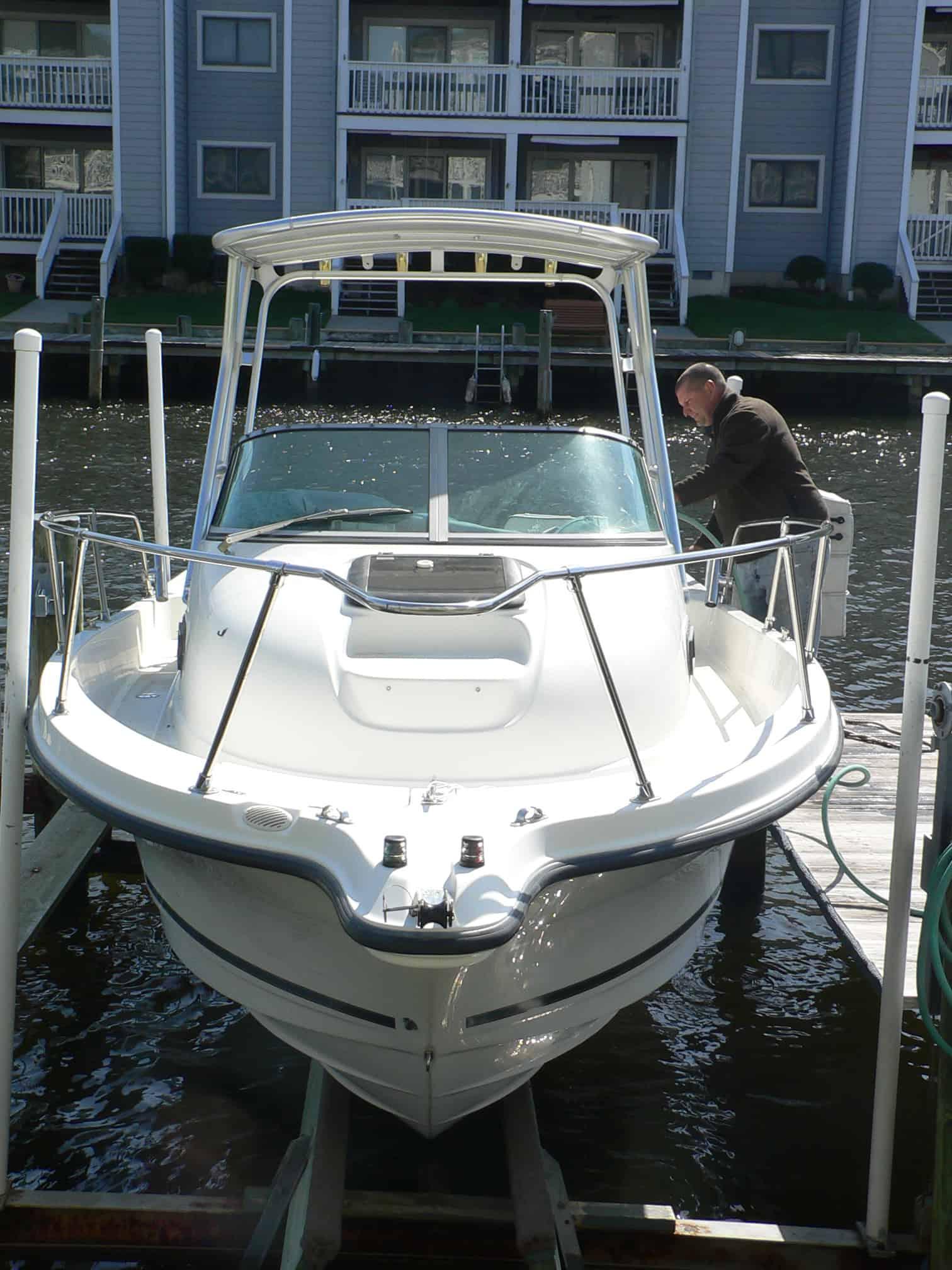 Atlantic Towers Top installed on a Trophy 2002 walkaround boat, showing black framework and canvas cover.