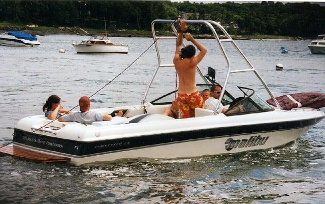 Atlantic Towers Air Tower installed on a Malibu Sunsetter LX boat with people enjoying time on the water.