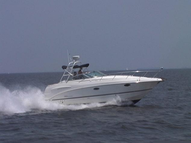 Atlantic Towers Arch installed on a Chaparral 280/290 Signature boat cruising on calm waters.