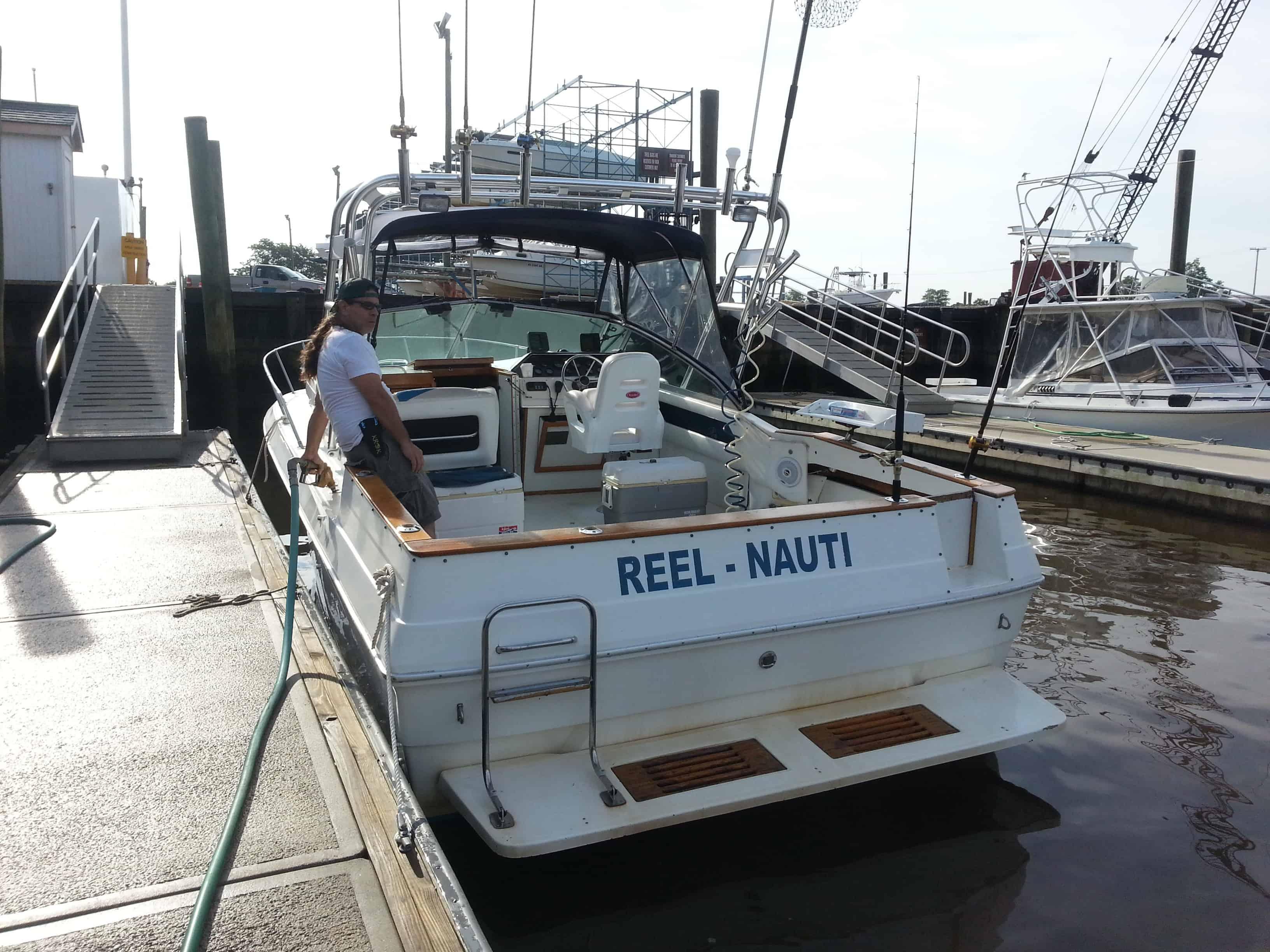 Atlantic Towers Arch installed on Sea Ray 270 Amberjack Express Fisherman boat showing a cockpit and helm area.