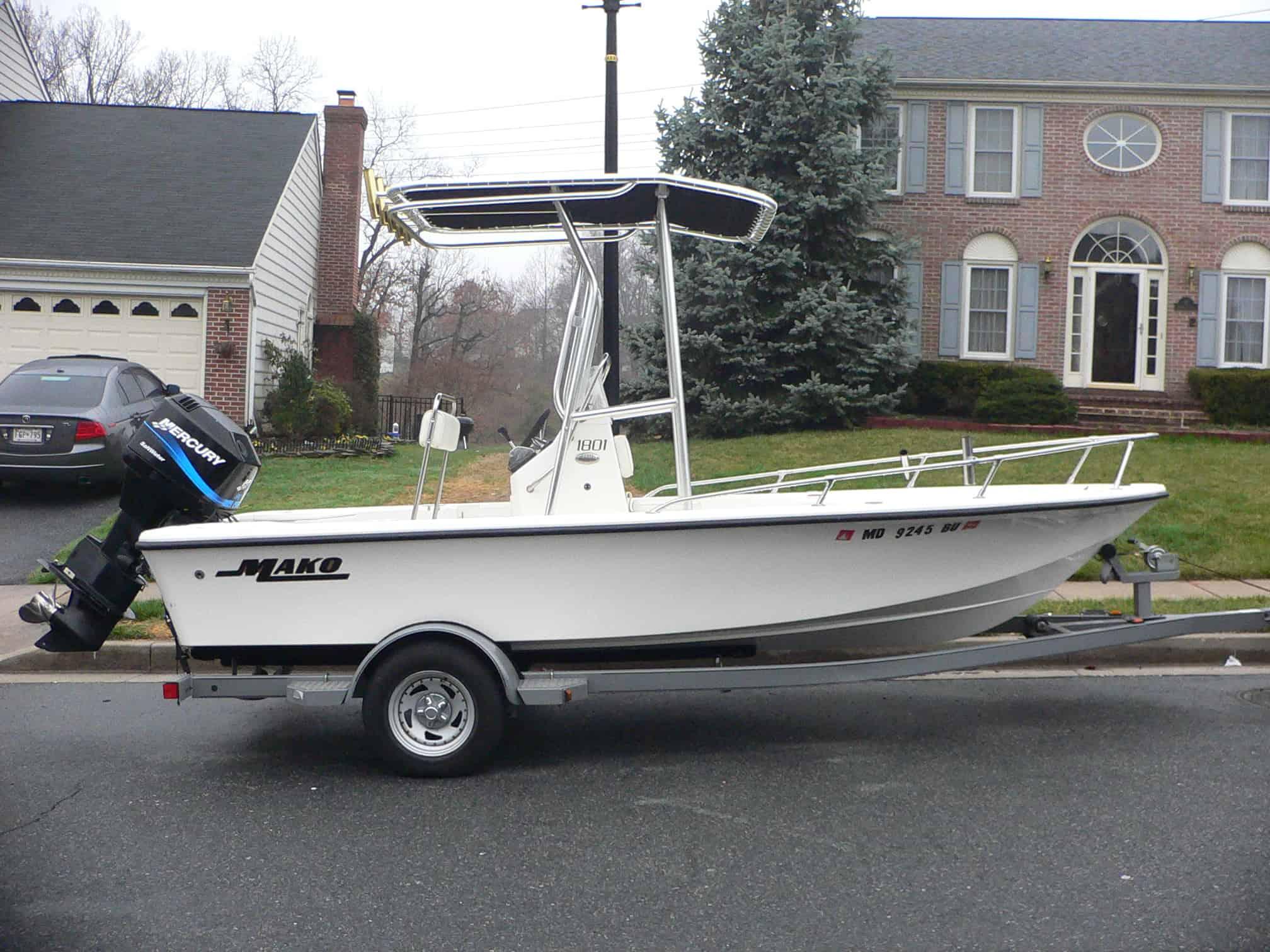 Atlantic Towers T-Top installed on a Mako 18 Center Console boat parked on a residential street.