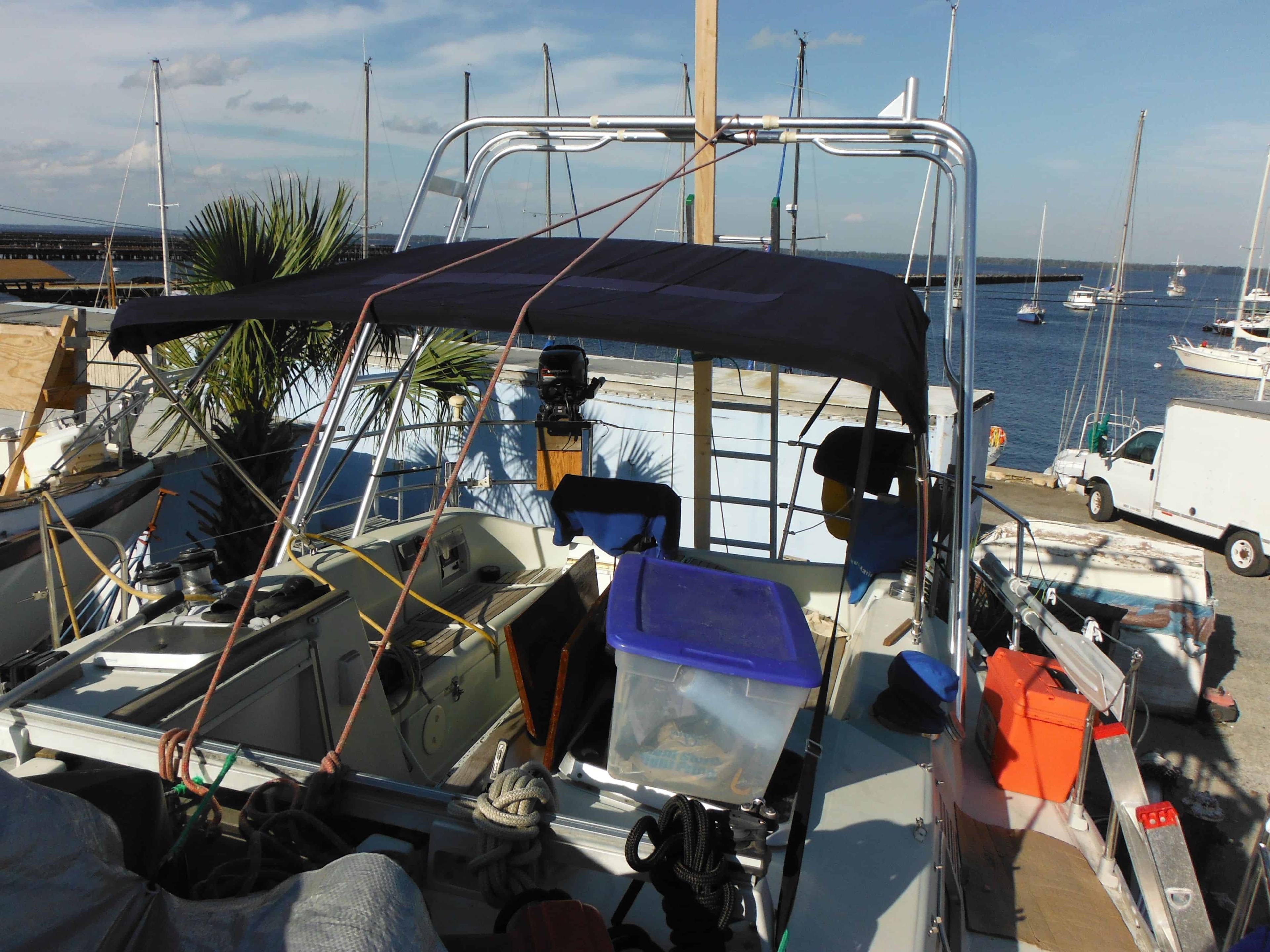 Atlantic Towers Arch installed on a Beneteau Mooring 38 sailboat with rigging and sails visible on the water.