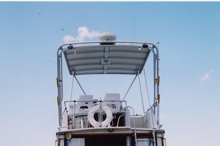 Atlantic Towers Top installed on a Viking Sportfish boat, showcasing a canopy with seating and a life ring.