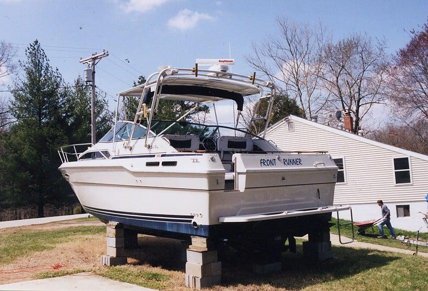 Atlantic Towers Top installed on a Sea Ray 300 Weekender boat, positioned on supports in a yard.
