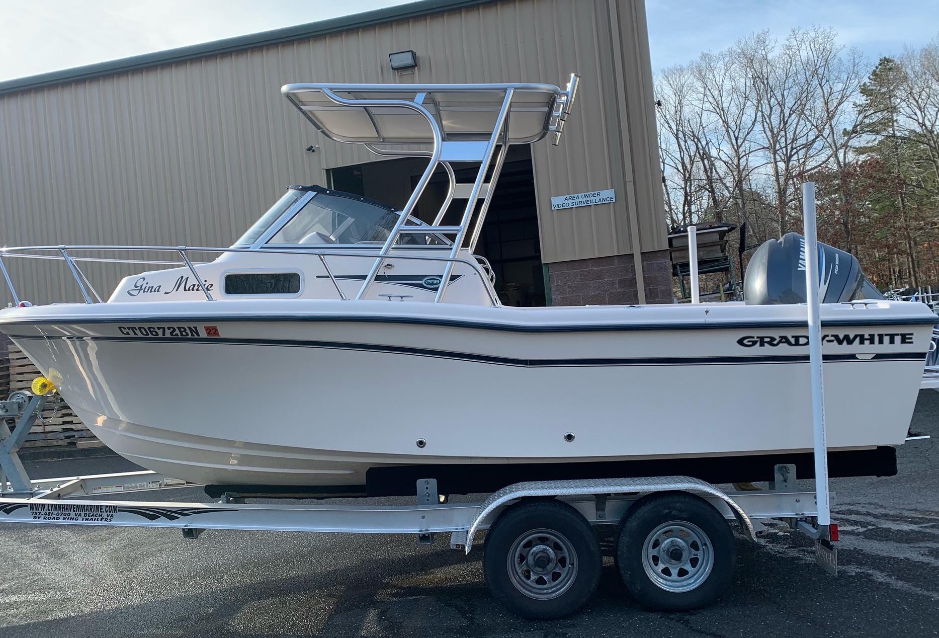 Side view of a Grady White boat on a trailer equipped with an Atlantic Towers Top aluminum tower with a canvas top.