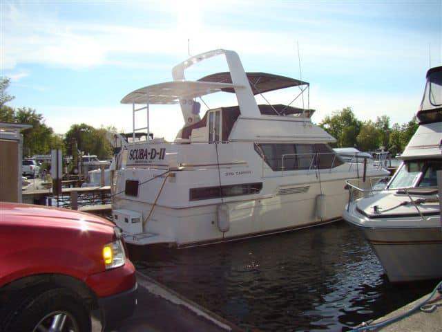 Atlantic Towers Aft Deck Top installed on a Carver 36/370 Aft Cabin boat docked at a marina.