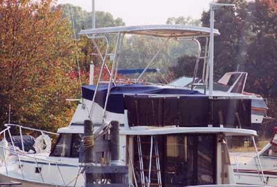 Atlantic Towers Top installed on a Mainship 34 Motor Cruiser, showcasing its design and structure on the water.