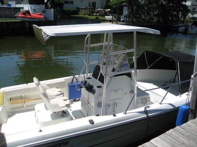 Atlantic Towers T-Top installed on a Hydra Sports 212 walkaround boat shown from a side view on the water.