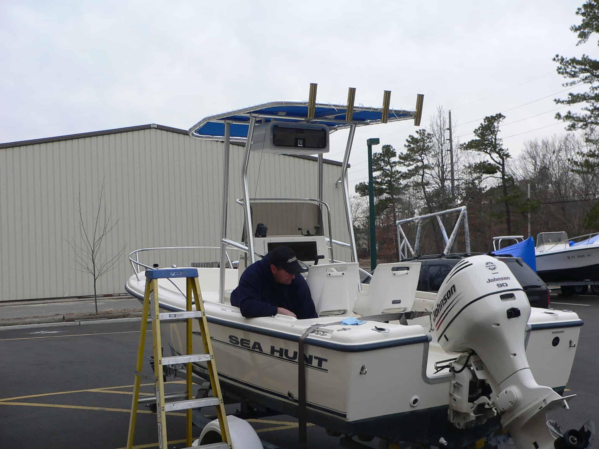 Atlantic Towers T-Top on a Sea Hunt 175 center console boat, showcasing a sleek design and functional features.