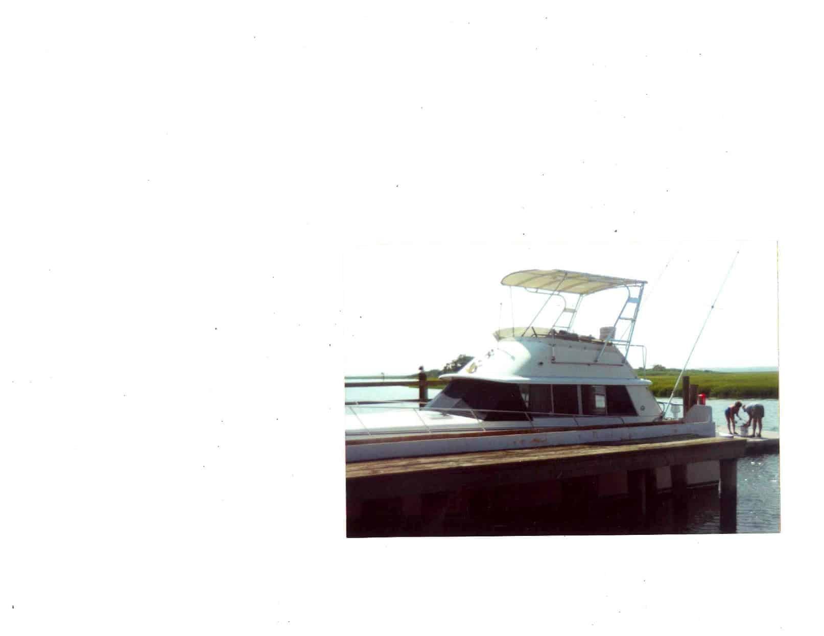 Atlantic Towers Top installed on a Silverton 37 Convertible boat at a dock, with people nearby.