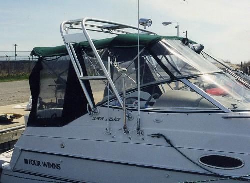 Four Winns 258 Vista boat with installed Atlantic Towers Arch and black enclosure on the deck area.